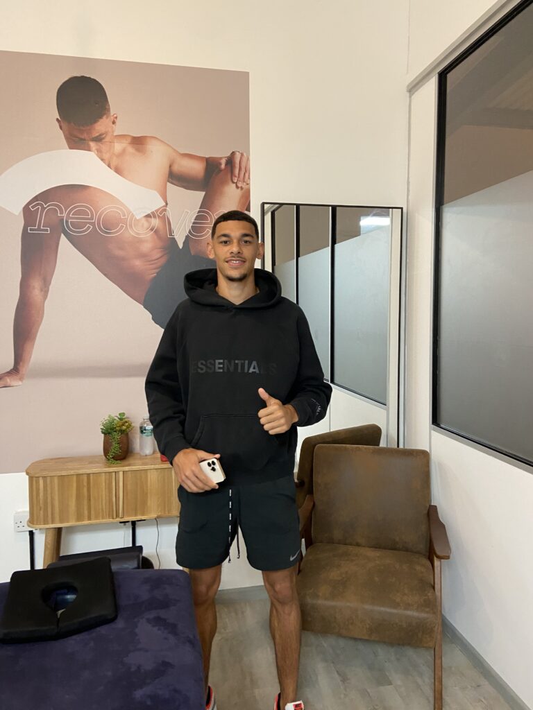 Athlete working with a physiotherapist to improve strength and prevent injuries