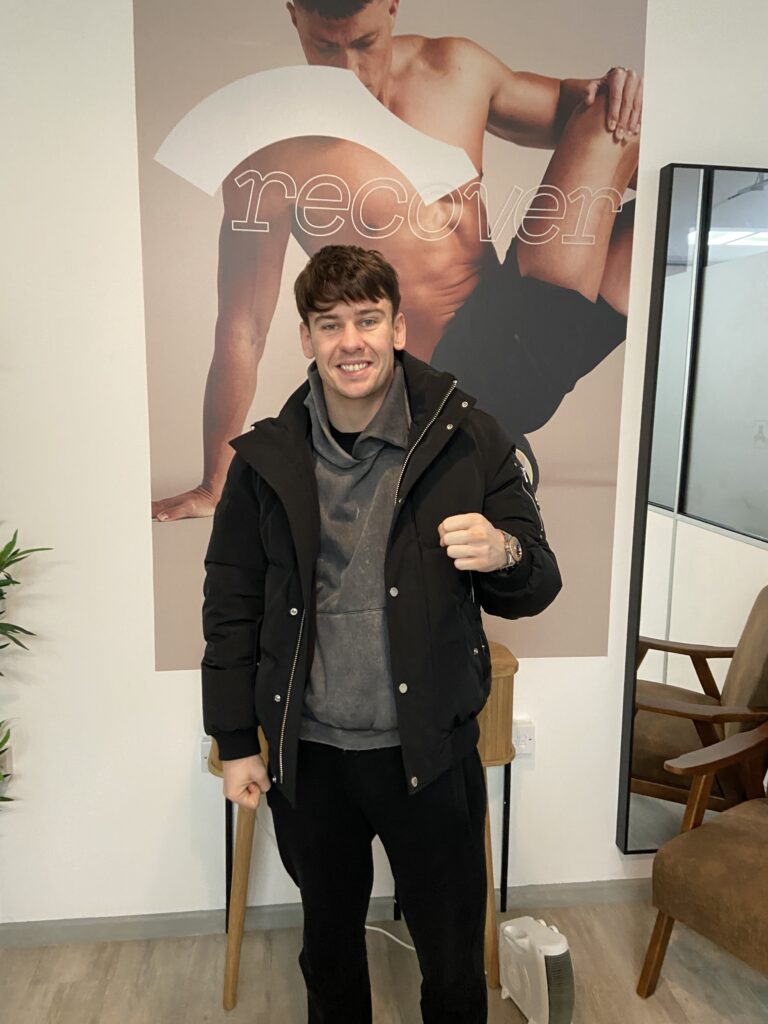 Male athlete receiving expert physiotherapy for sports injury recovery